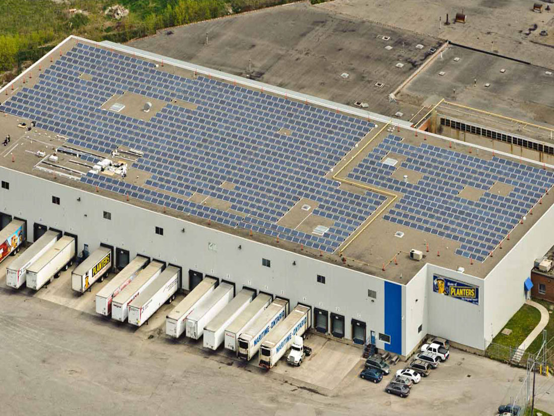 View of Planters Peanuts Solar panels on top of their building.